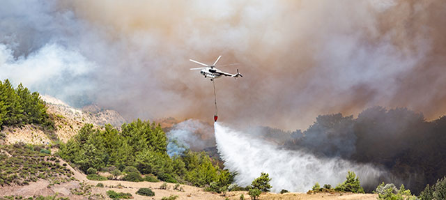 photo - Helicopter Dropping Water for Fire Fighting