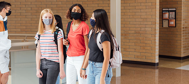 photo - High School Students Walking in Hallway, Wearing Masks