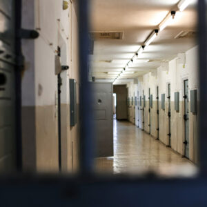 Photo - Long Hallway with Prison Cell Doors
