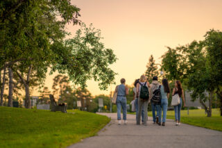 photo - University Students Walking Outside on Campus