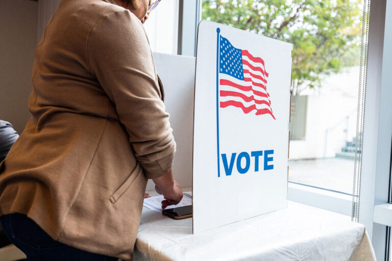photo - Woman at voting booth on election day